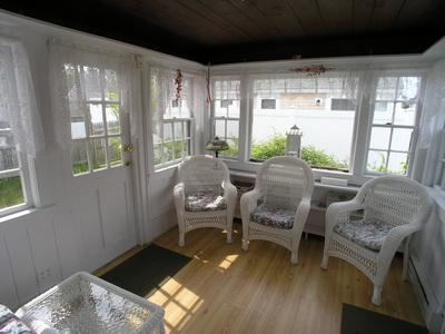 188 Captain Chase Road Dennis Port, MA 02639 - Photo 10 of 14 a living room with furniture and a large window