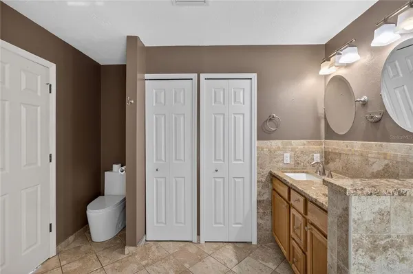 a view of a livingroom with a desk and chair