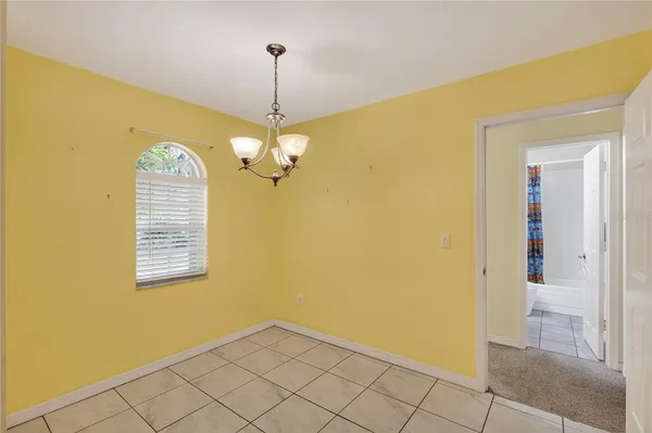 a view of a hallway with a chandelier