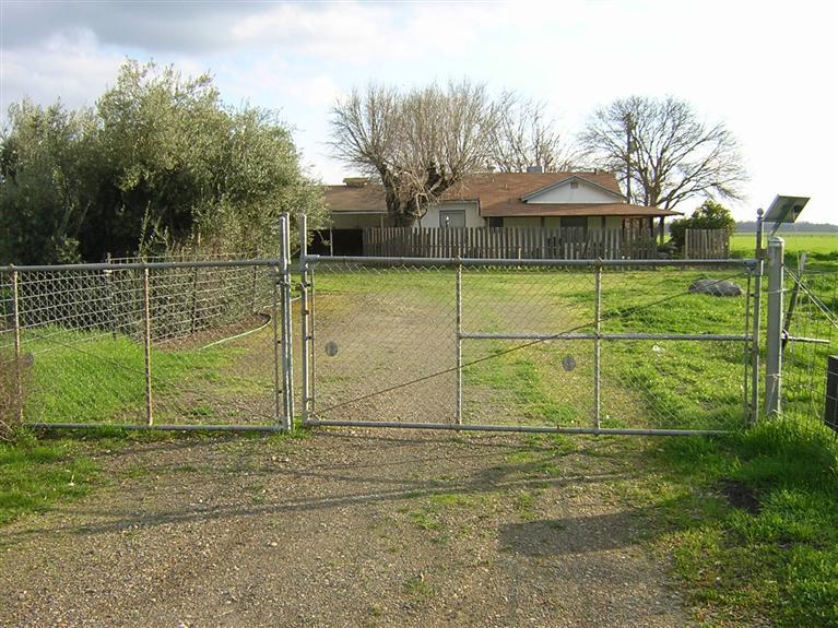 22479 East Kings Canyon Road, Unit A Reedley, CA 93654 - Photo 1 of 16 Front Gate - Solar Powered