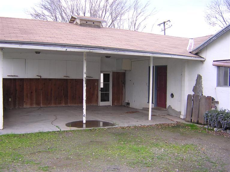 22479 East Kings Canyon Road, Unit A Reedley, CA 93654 - Photo 5 of 16 Car Port and entry to large storage area