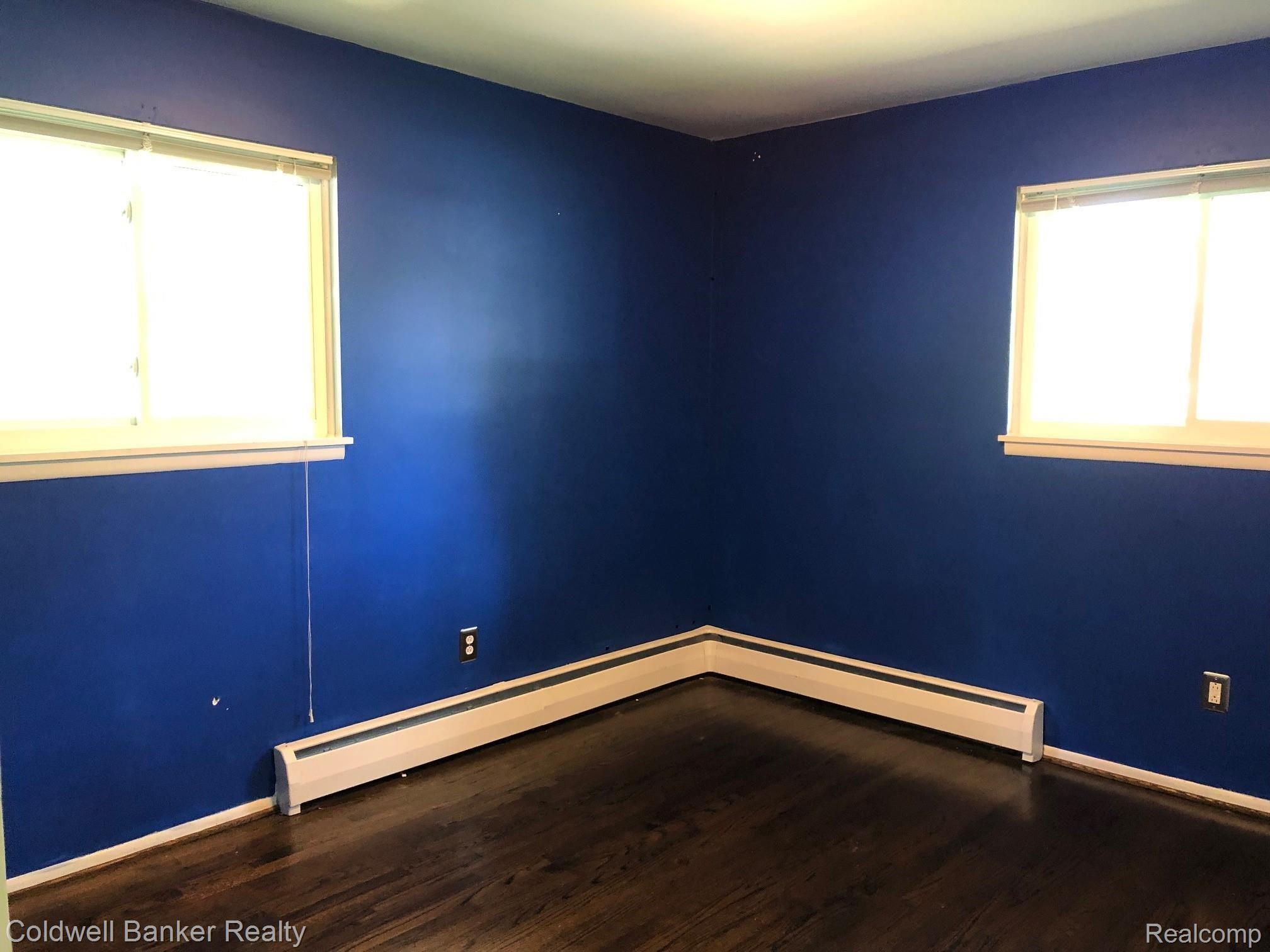 1839 Middle Trail Road Walled Lake, MI 48390 - Photo 10 of 21 Bedroom with Wood Floors