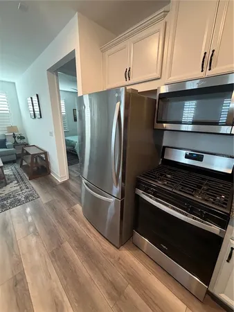 a kitchen with a stove and a refrigerator
