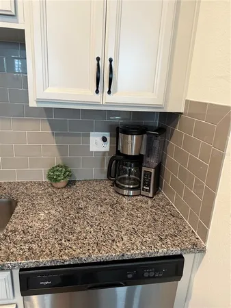 a kitchen with a stove and a microwave