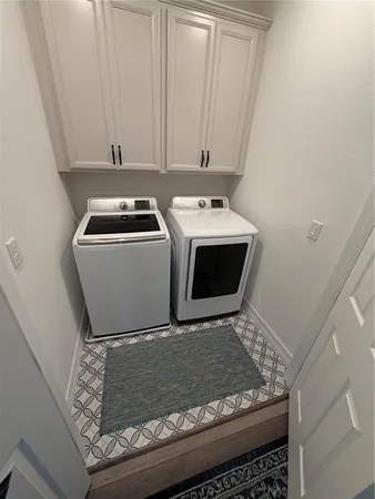 a utility room with washer and dryer