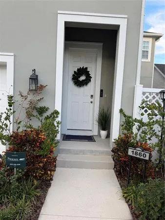 a entryway view with a flower garden