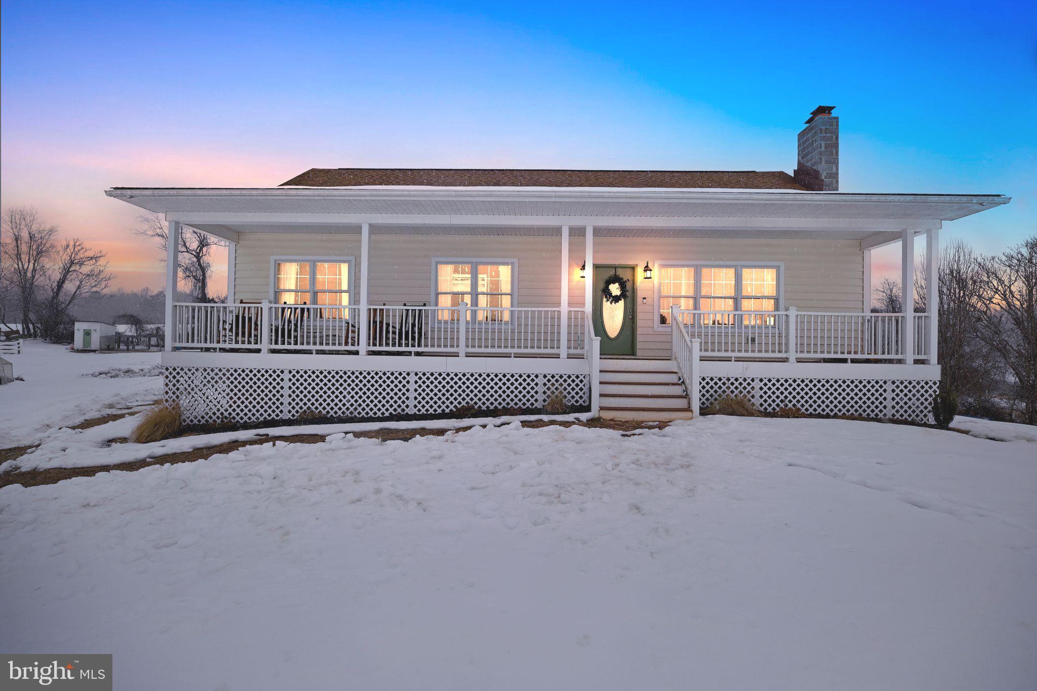 Charming home nestled in a snowy landscape.