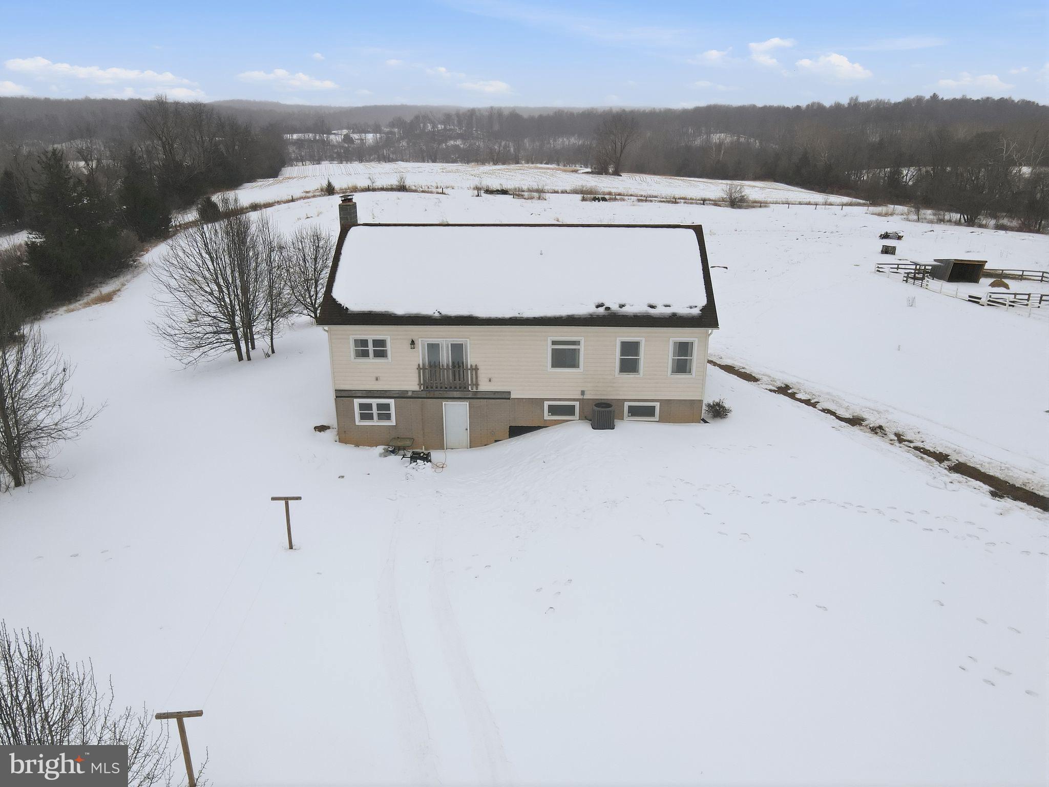 7466 Meadow View Lane Rixeyville, VA 22737 - Photo 2 of 41 Charming home nestled in a snowy landscape.