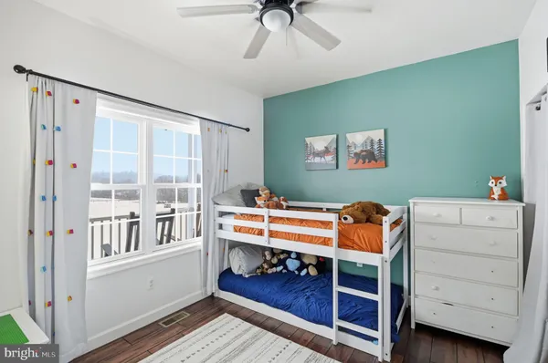 a bed room with a bed and a window