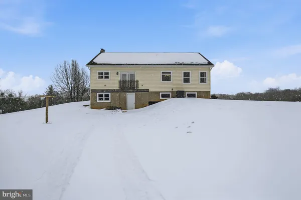 a view of roof and covered with snow