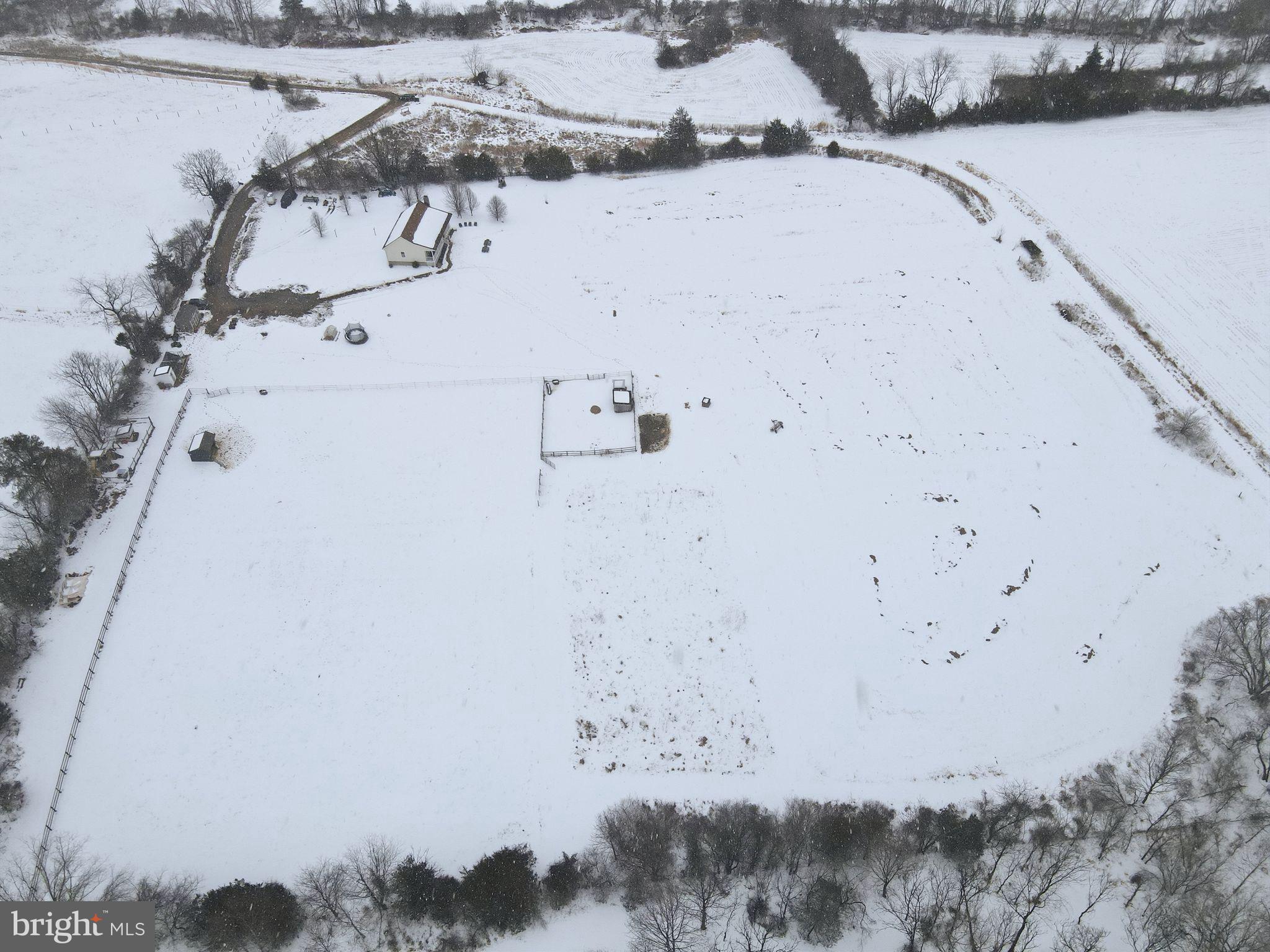 7466 Meadow View Lane Rixeyville, VA 22737 - Photo 34 of 41 Snow-covered landscape with a serene farmhouse.