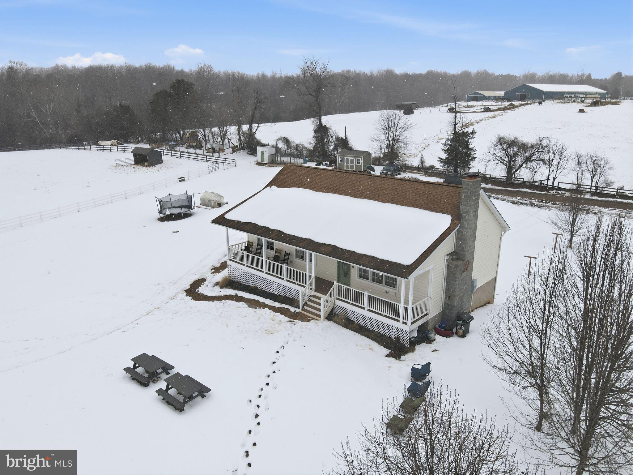 7466 Meadow View Lane Rixeyville, VA 22737 - Photo 36 of 41 Charming home nestled in a snowy landscape.