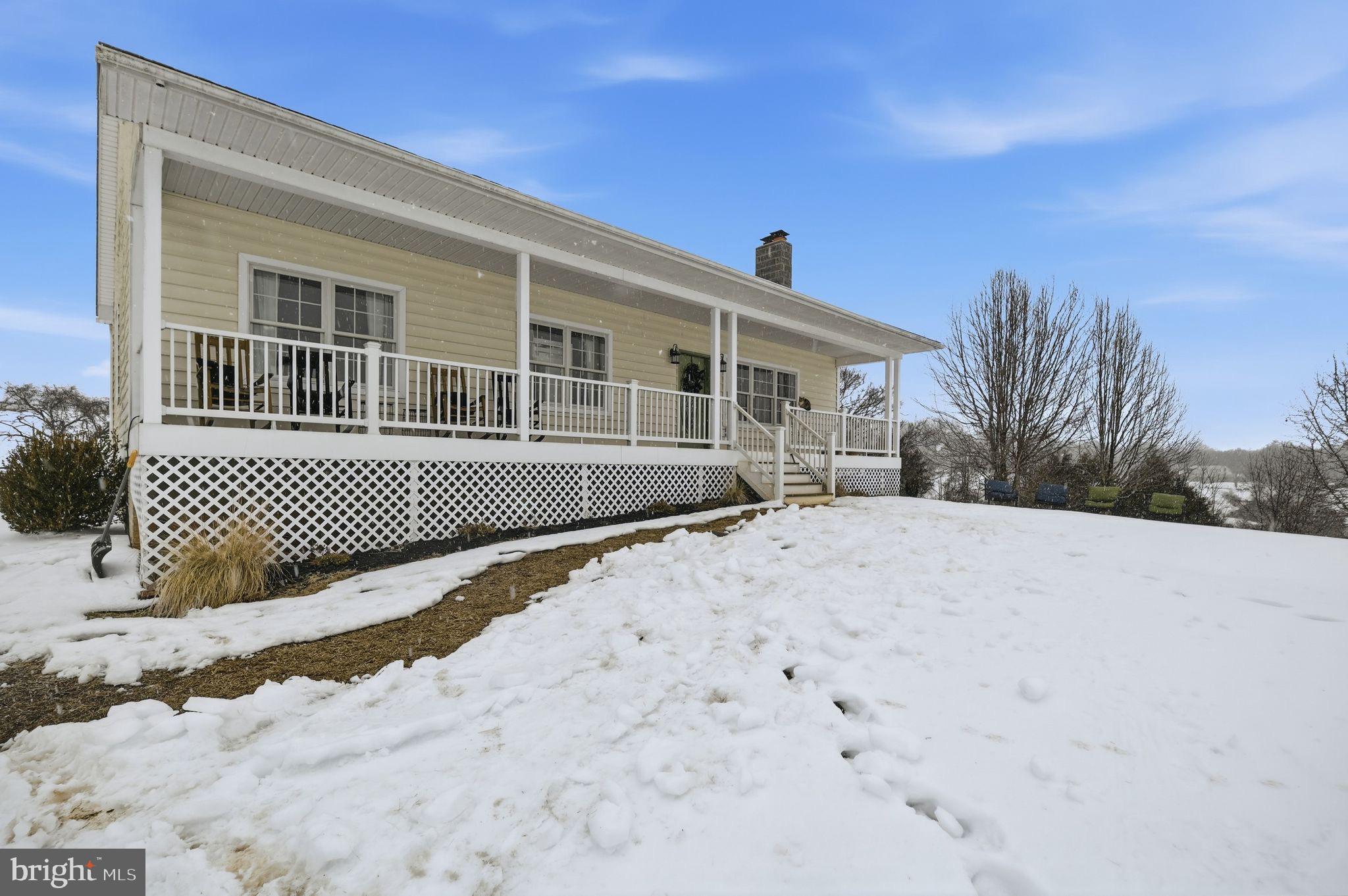 7466 Meadow View Lane Rixeyville, VA 22737 - Photo 37 of 41 Charming home nestled in a snowy landscape.