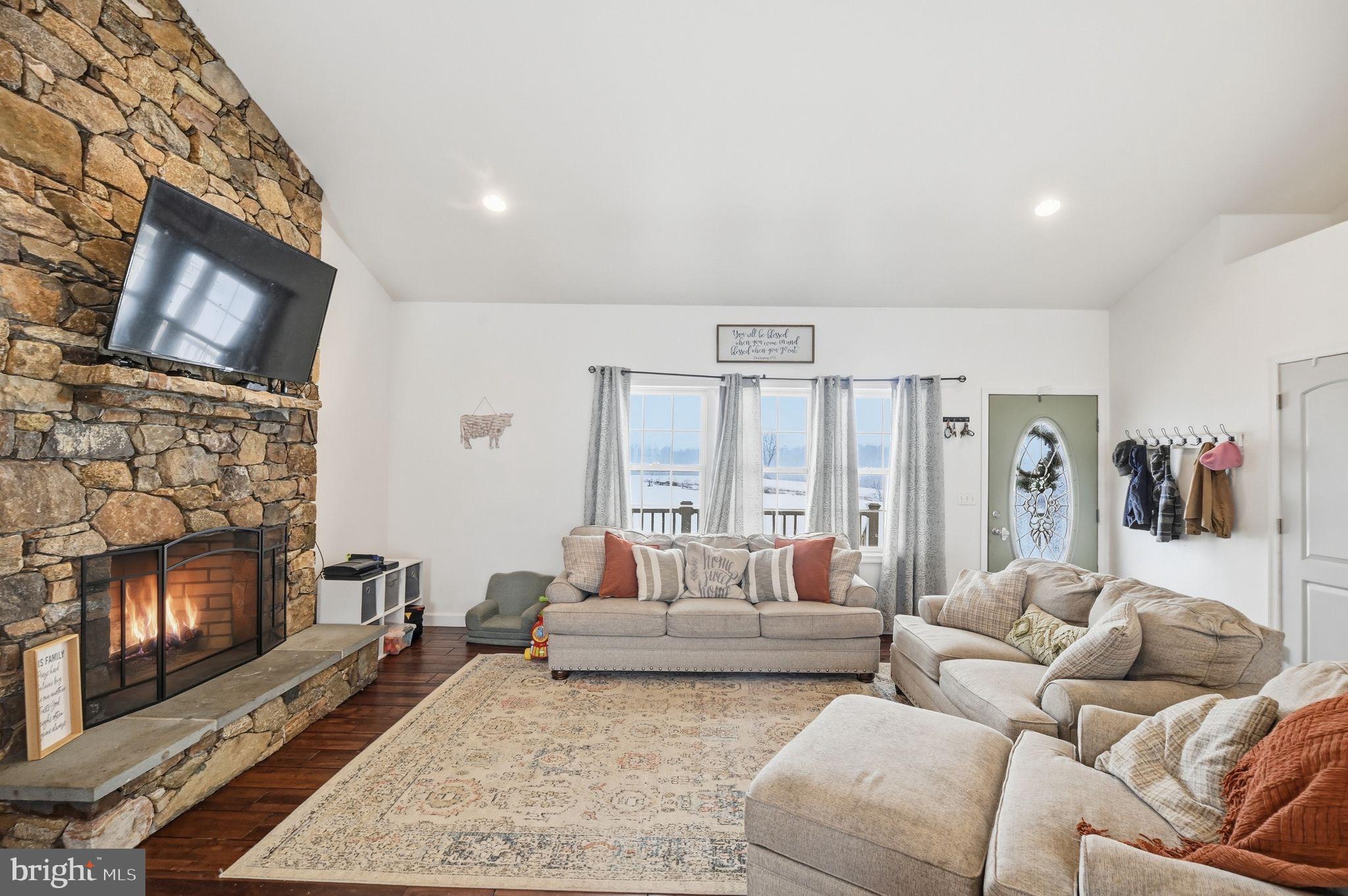 7466 Meadow View Lane Rixeyville, VA 22737 - Photo 8 of 41 Cozy living room with stone fireplace charm.