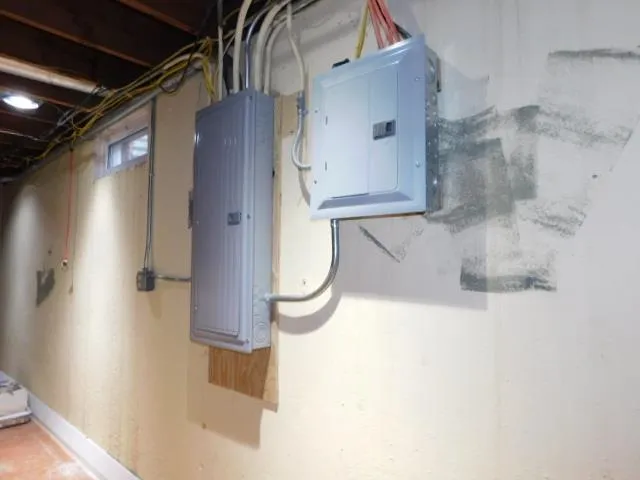 a kitchen with stainless steel appliances granite countertop a refrigerator a sink a stove and a refrigerator