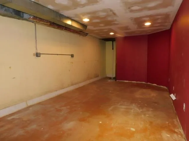 a kitchen with stainless steel appliances granite countertop a sink a stove and a wooden floors