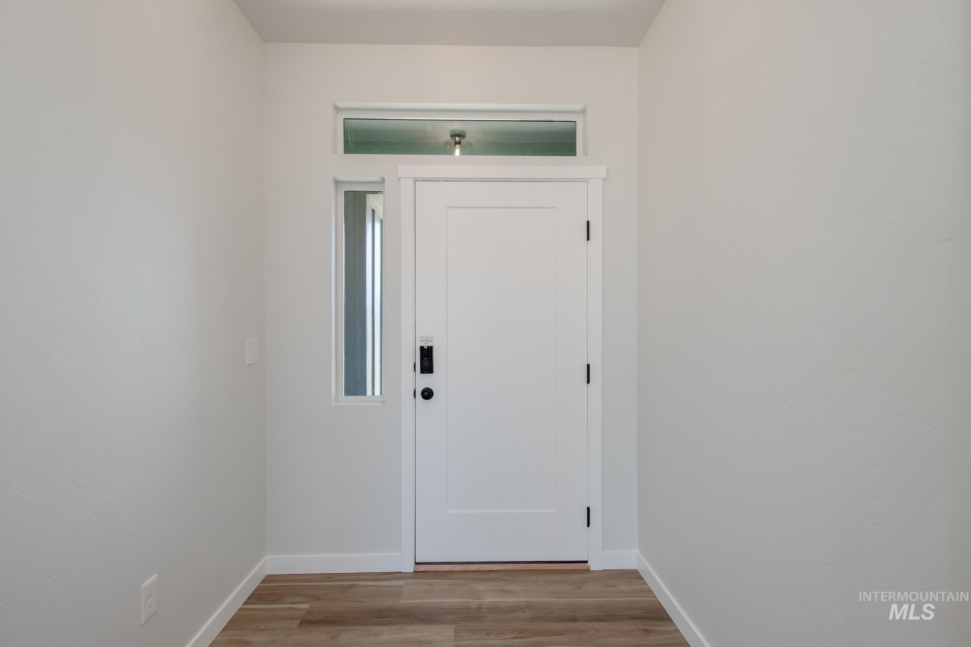 1634 Dyer Street Middleton, ID 83644 - Photo 2 of 25 Foyer with light wood finished floors and baseboards