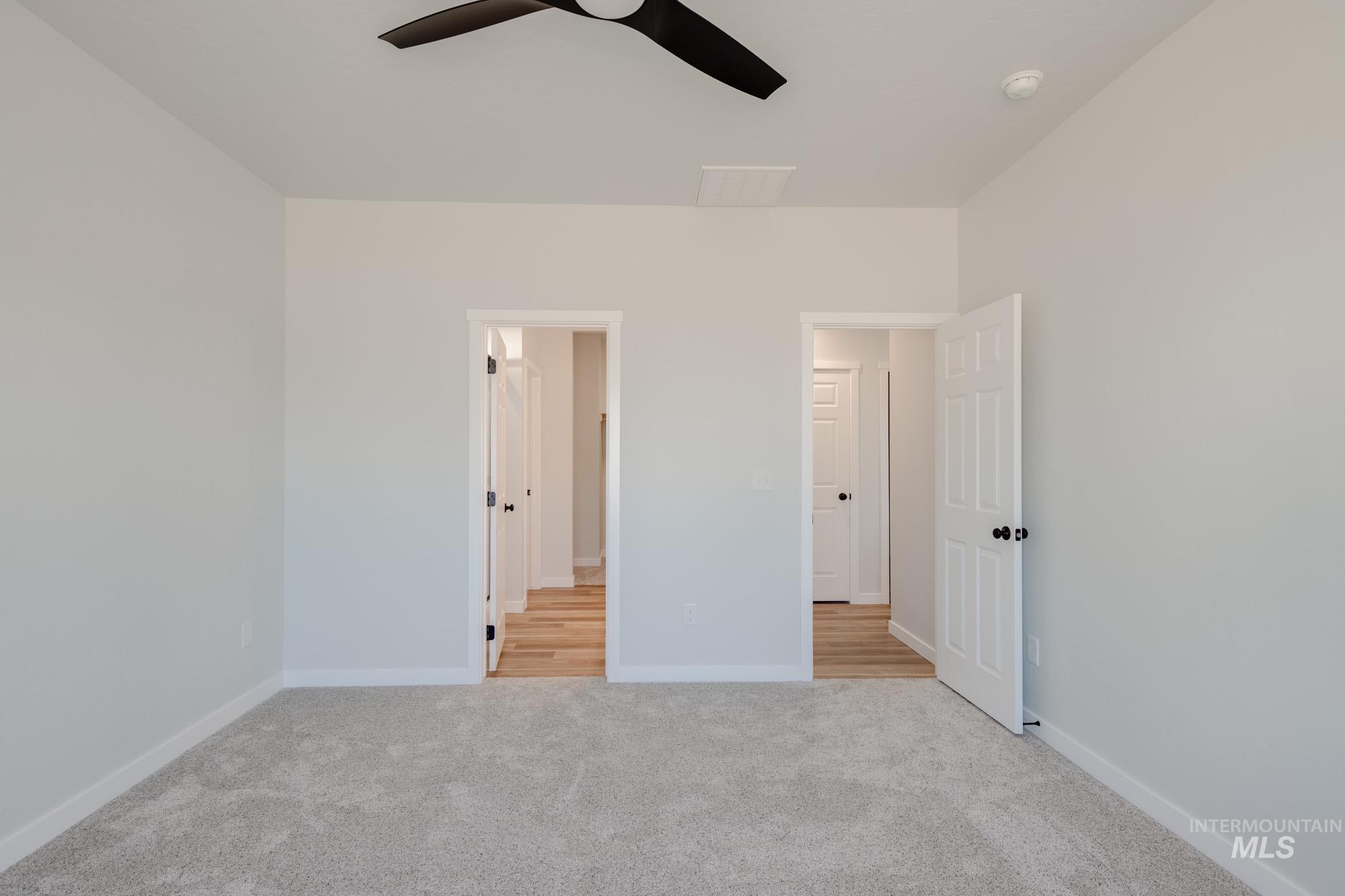 1634 Dyer Street Middleton, ID 83644 - Photo 18 of 25 Unfurnished bedroom featuring light colored carpet and ceiling fan