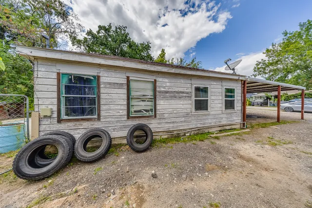 a front view of a house with parking space
