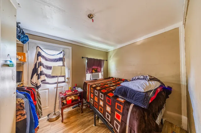 a bedroom with two beds and a closet