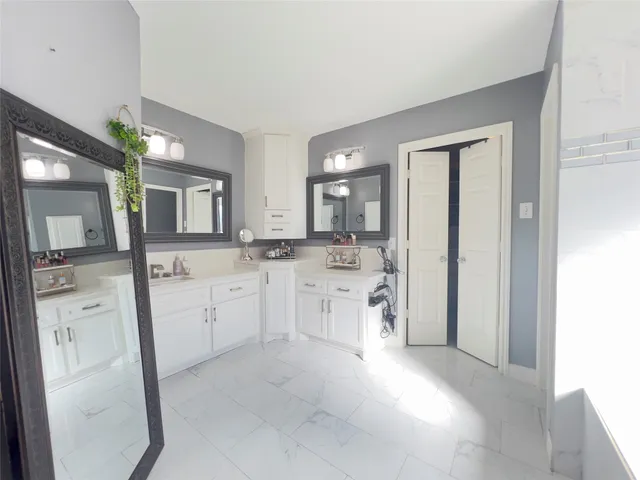 a bathroom with a tub and shower