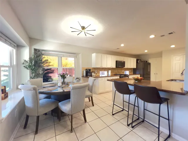 a view of a dining room with furniture