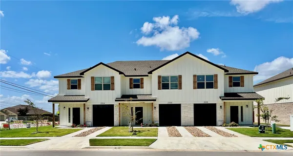 a front view of a large white building