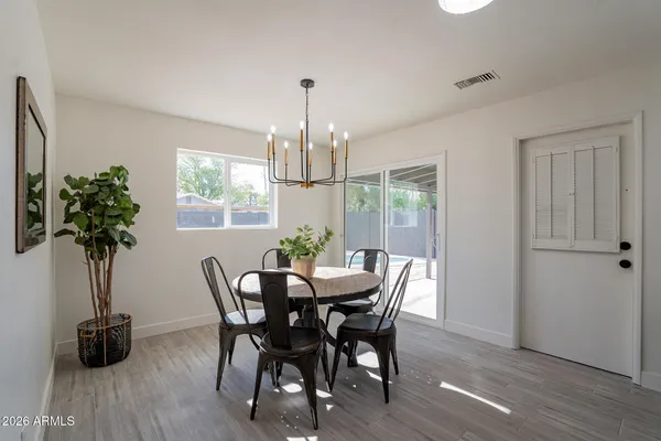 a view of a dining room with furniture and window
