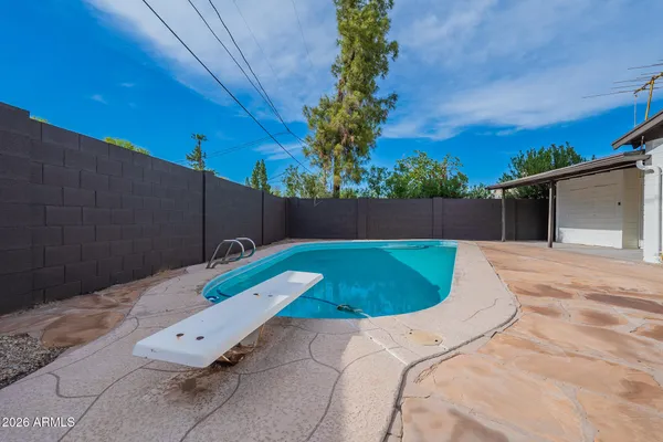 a view of a backyard with a tub