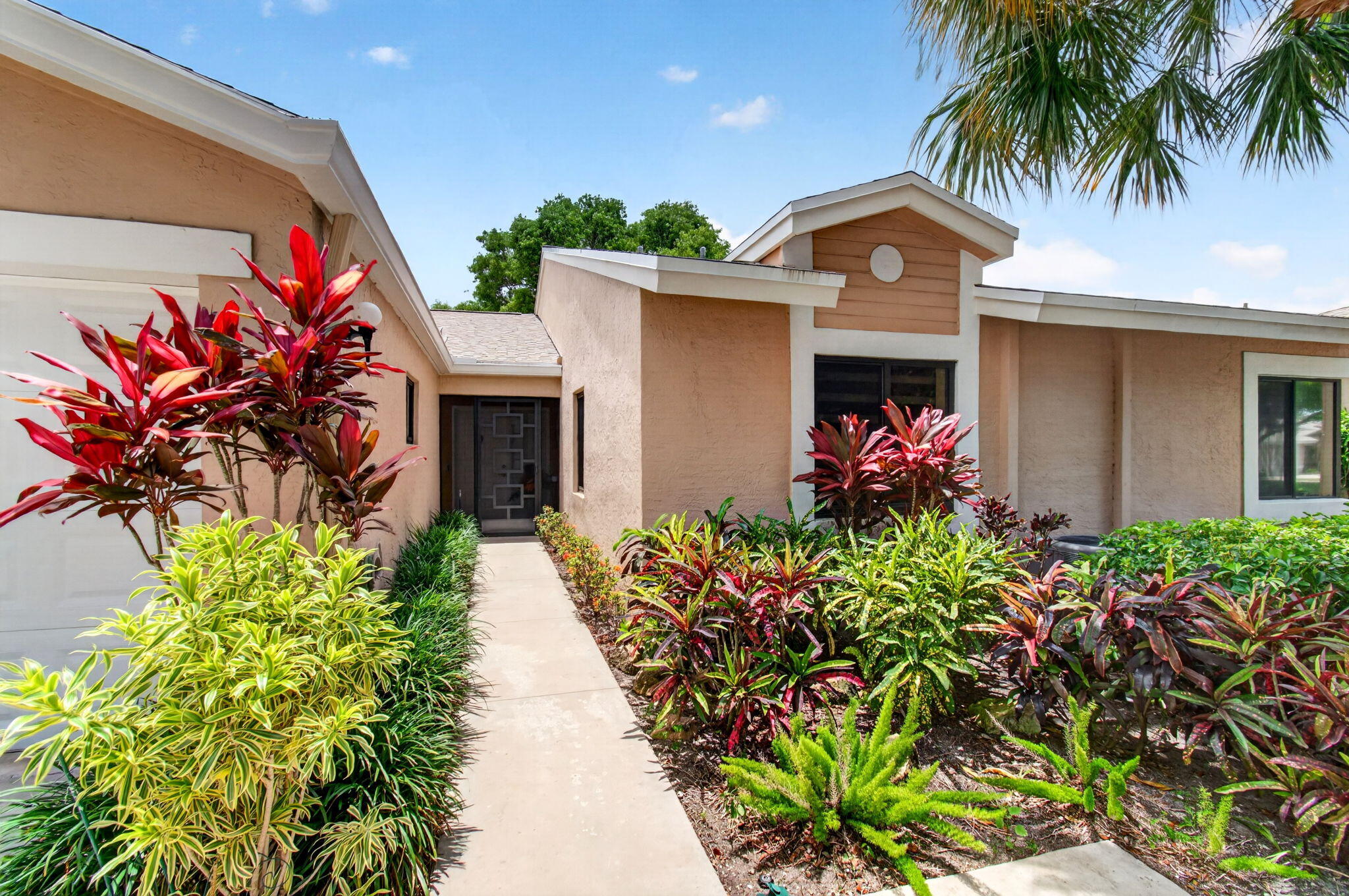 8310 Springlake Drive Boca Raton, FL 33496 - Photo 2 of 53 Lush tropical landscaping