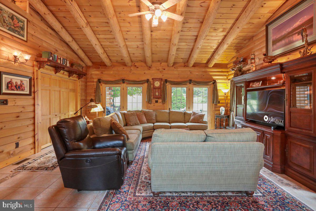 14122 Mercersburg Road Clear Spring, MD 21722 - Photo 19 of 143 a living room with furniture and a flat screen tv