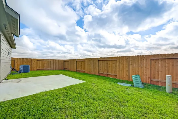 a view of a backyard with sitting area