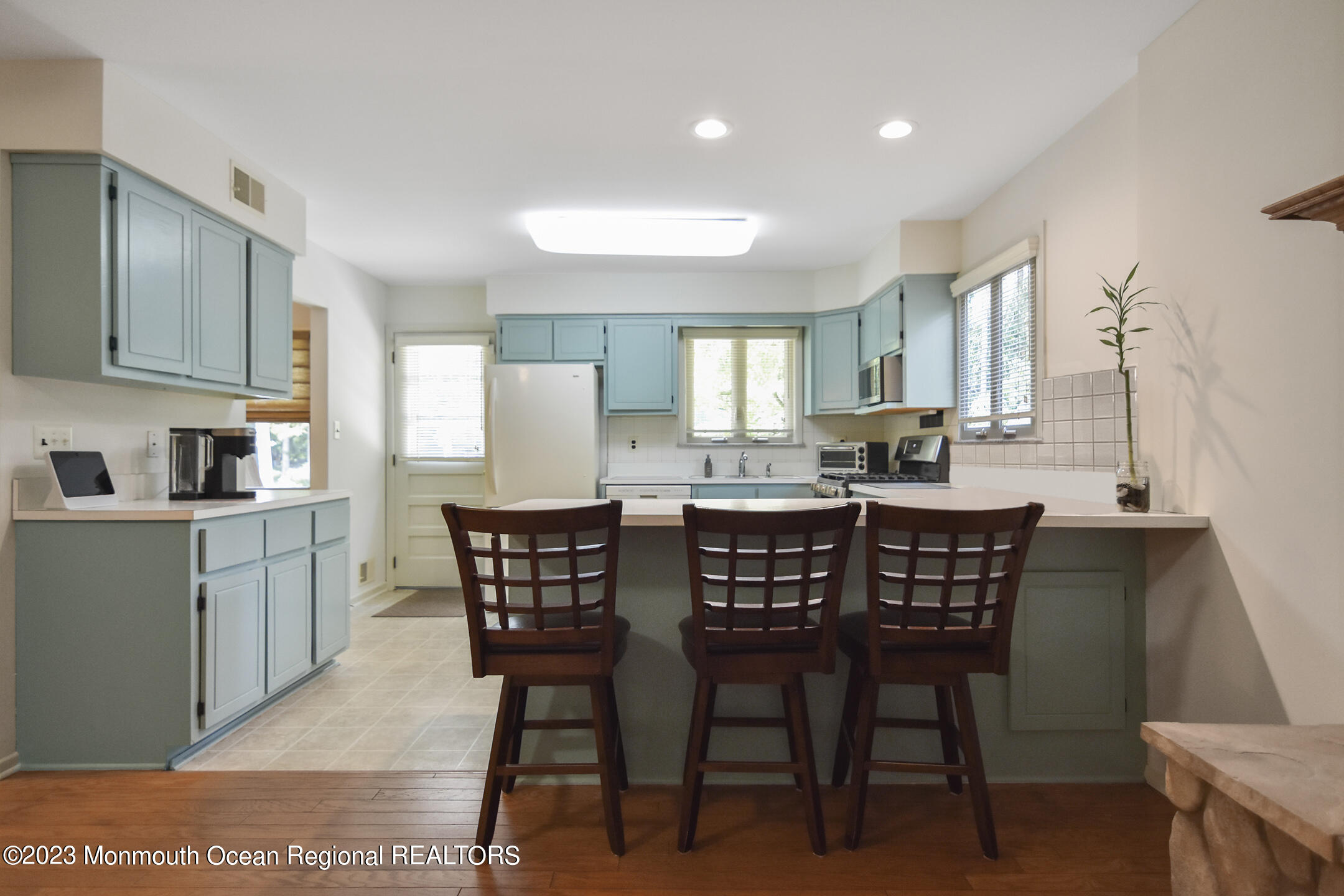 357 Easy Street Howell, NJ 07731 - Photo 13 of 36 a kitchen with a dining table chairs and refrigerator