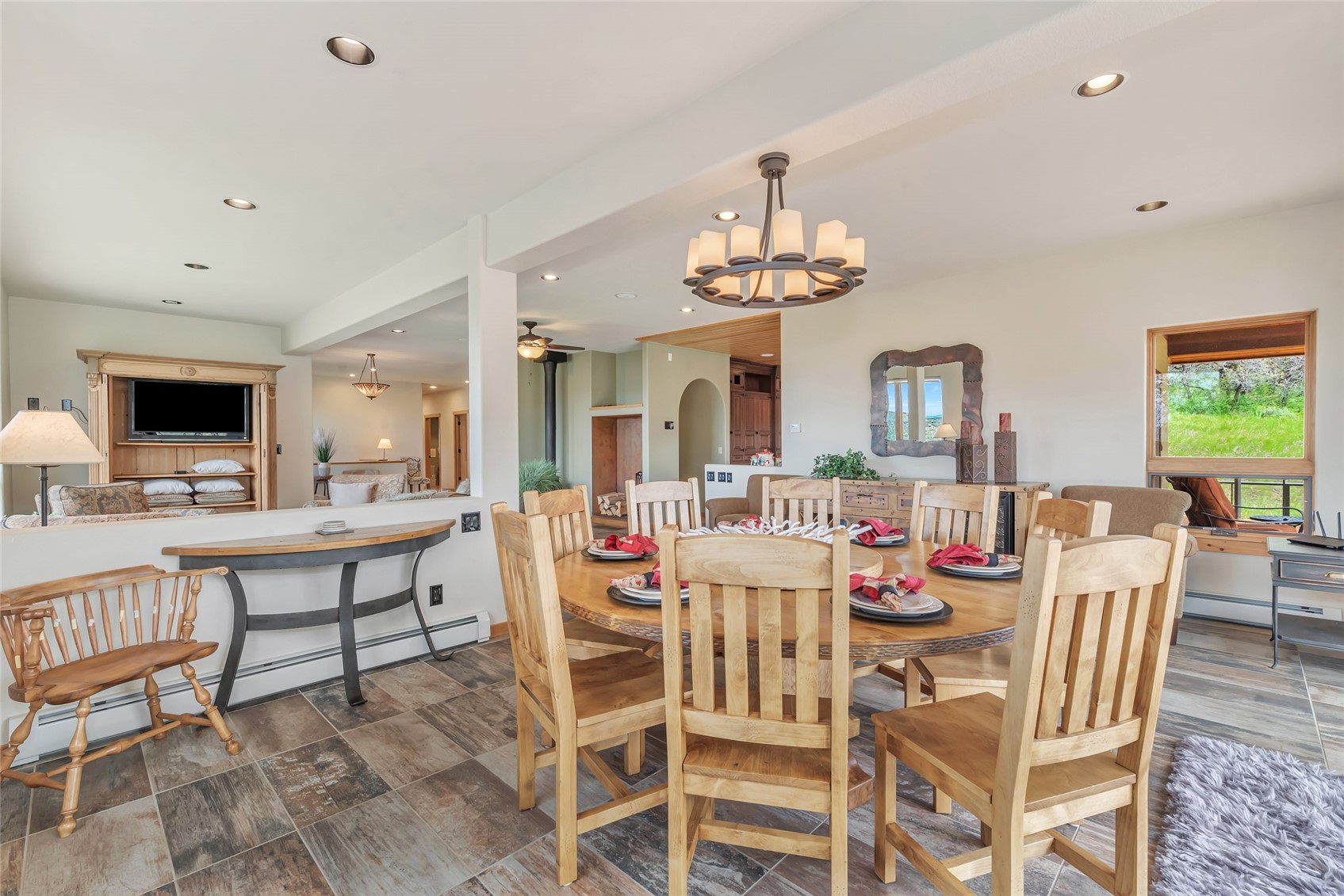 31485 Deerwood Ranch Road Steamboat Springs, CO 80487 - Photo 20 of 49 a view of a dining room with furniture and a livingroom