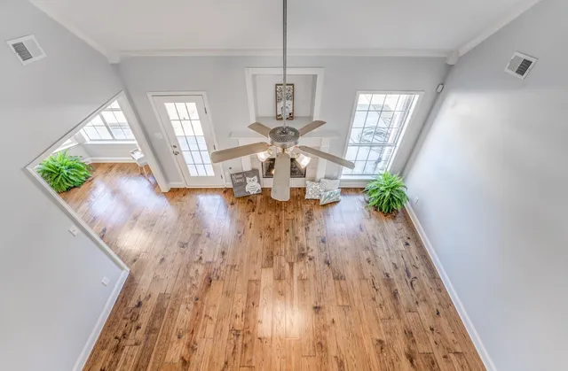 a view of an entryway with wooden floor
