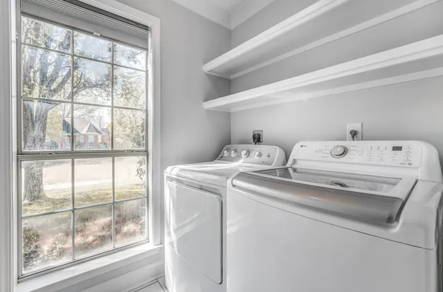 a utility room with dryer and washer