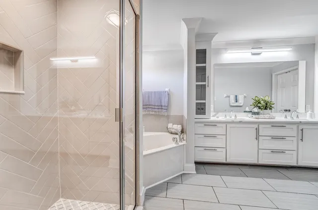 a bathroom with a sink a mirror and a bathtub