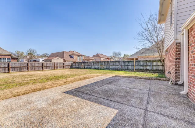 a view of swimming pool with a yard