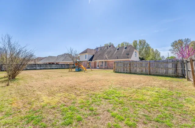 a view of a swimming pool with an outdoor space and seating area
