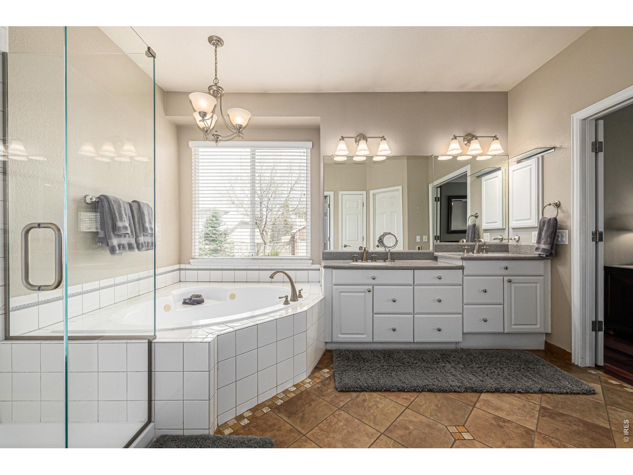 447 Beaver Point Lafayette, CO 80026 - Photo 14 of 37 Primary Bath with new shower and jetted tub (main level)