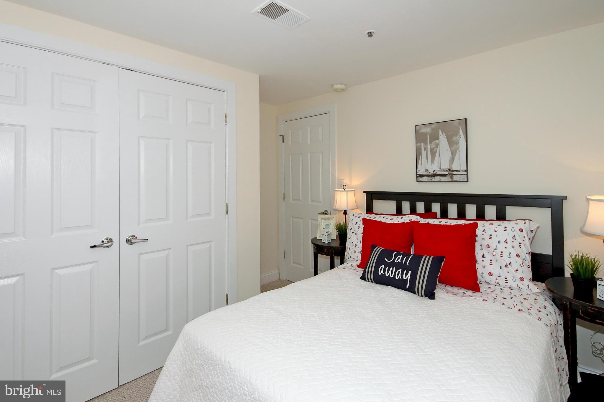 1727 R Street Northwest, Unit 101 Washington, DC 20009 - Photo 13 of 30 a bed room with a bed and a night stand