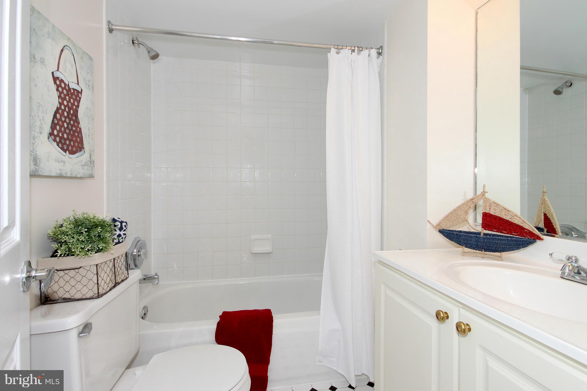 1727 R Street Northwest, Unit 101 Washington, DC 20009 - Photo 14 of 30 a bathroom with a sink toilet and shower