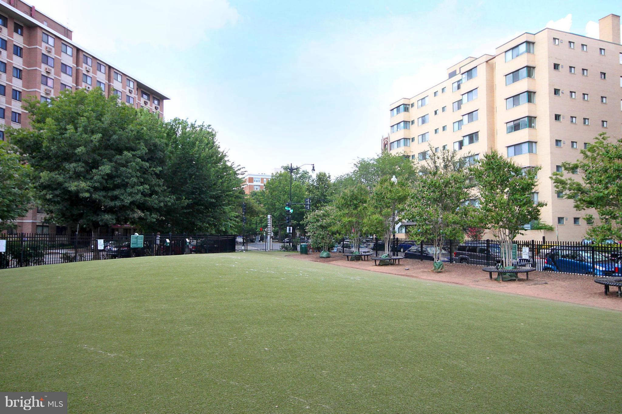 1727 R Street Northwest, Unit 101 Washington, DC 20009 - Photo 19 of 30 a view of a tall building with a yard and sitting area