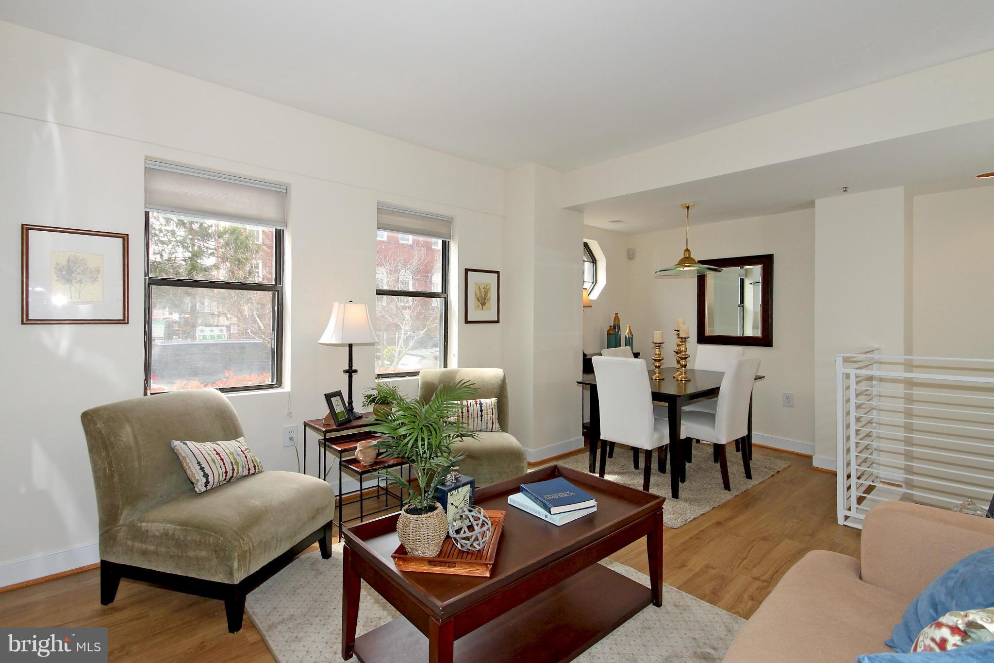 1727 R Street Northwest, Unit 101 Washington, DC 20009 - Photo 4 of 30 a living room with furniture a rug and a window
