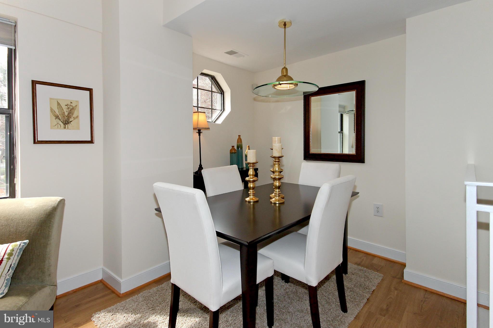 1727 R Street Northwest, Unit 101 Washington, DC 20009 - Photo 5 of 30 a view of a dining room with furniture and wooden floor