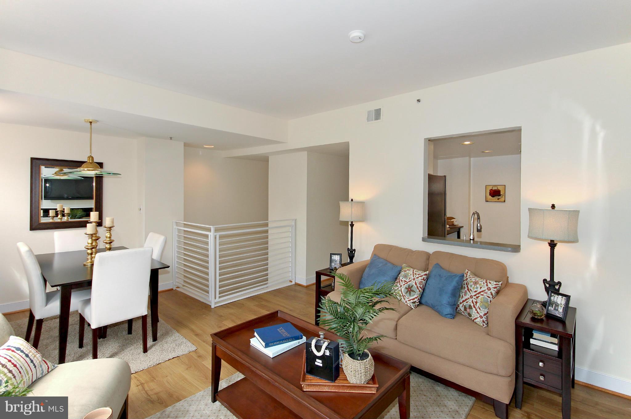 1727 R Street Northwest, Unit 101 Washington, DC 20009 - Photo 6 of 30 a living room with furniture a lamp and a flat screen tv