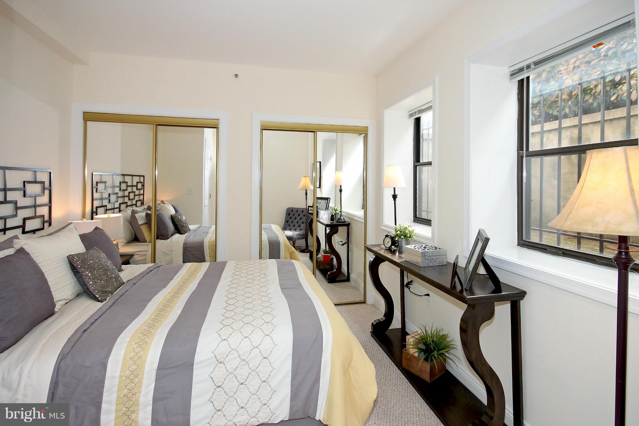 1727 R Street Northwest, Unit 101 Washington, DC 20009 - Photo 9 of 30 a bedroom with two beds and large windows