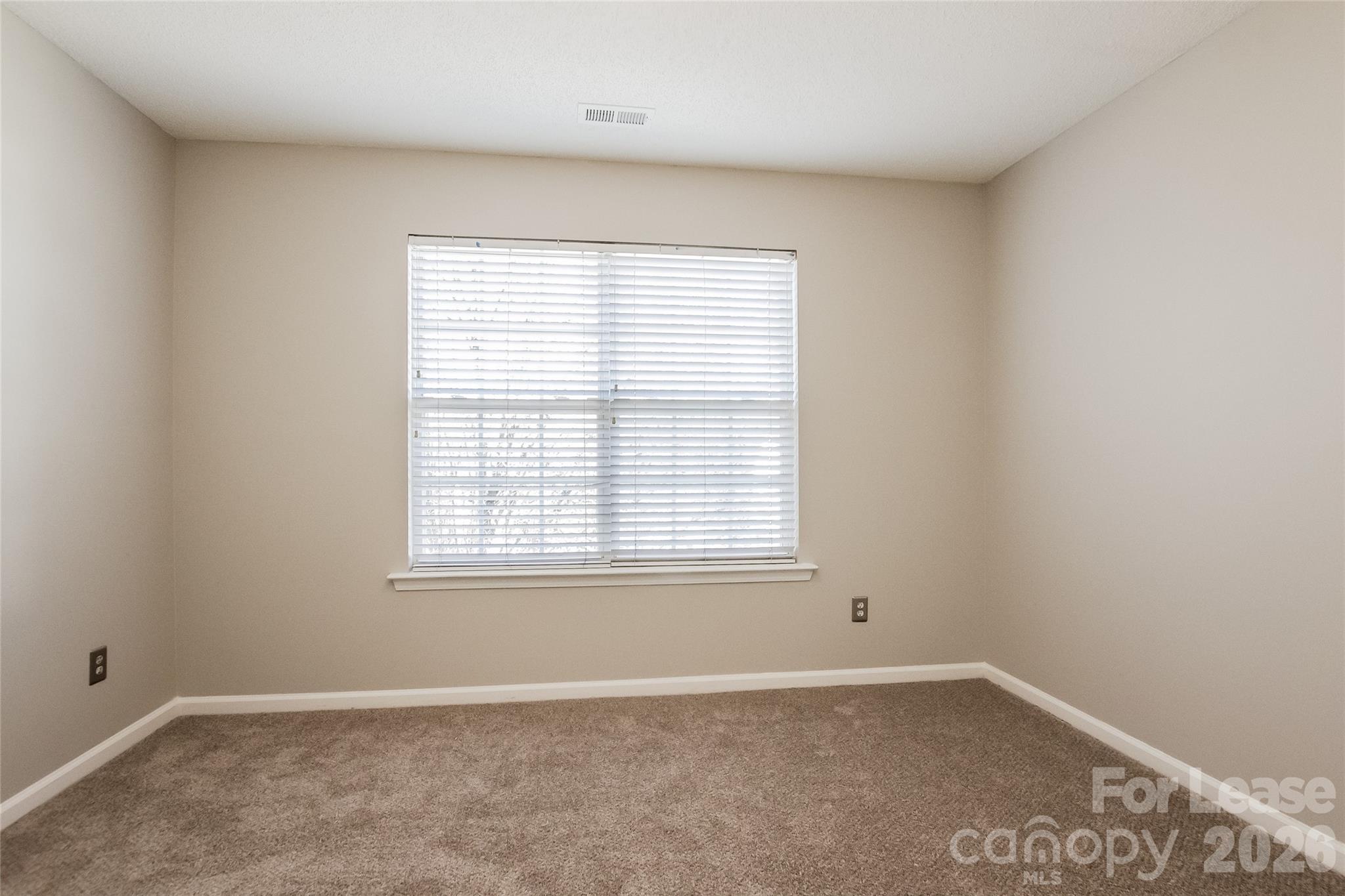 10802 Gold Pan Road Charlotte, NC 28215 - Photo 11 of 15 an empty room with a window