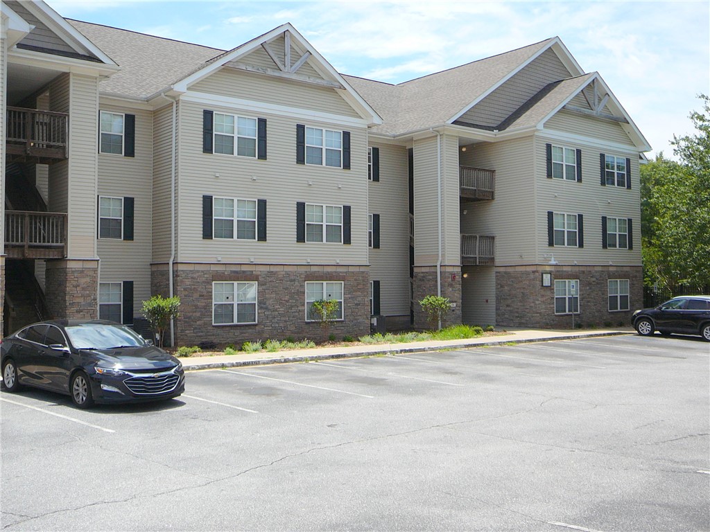 131 Lookover Drive Anderson, SC 29621 - Photo 1 of 18 A multi-story residential building features varied siding and balconies, offering comfortable living.