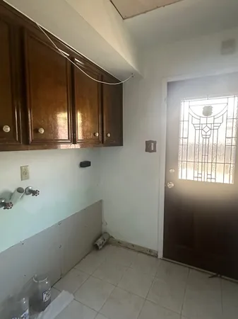a view of cabinets and window in a room